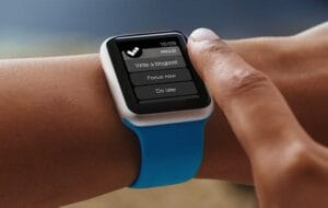 Smartwatch task manager app interface on wrist, enhancing productivity only with Elevate Your Organization's Culture and Performance With CEEK.