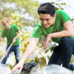 People volunteering in park cleanup, fostering community and environmental care, only with Elevate Your Organization's Culture and Performance With CEEK.
