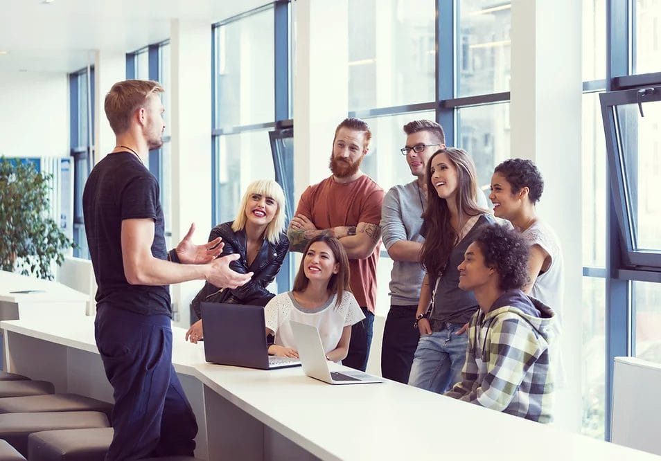 Team collaboration in a modern office setting, available at Elevate Your Organization's Culture and Performance With CEEK.