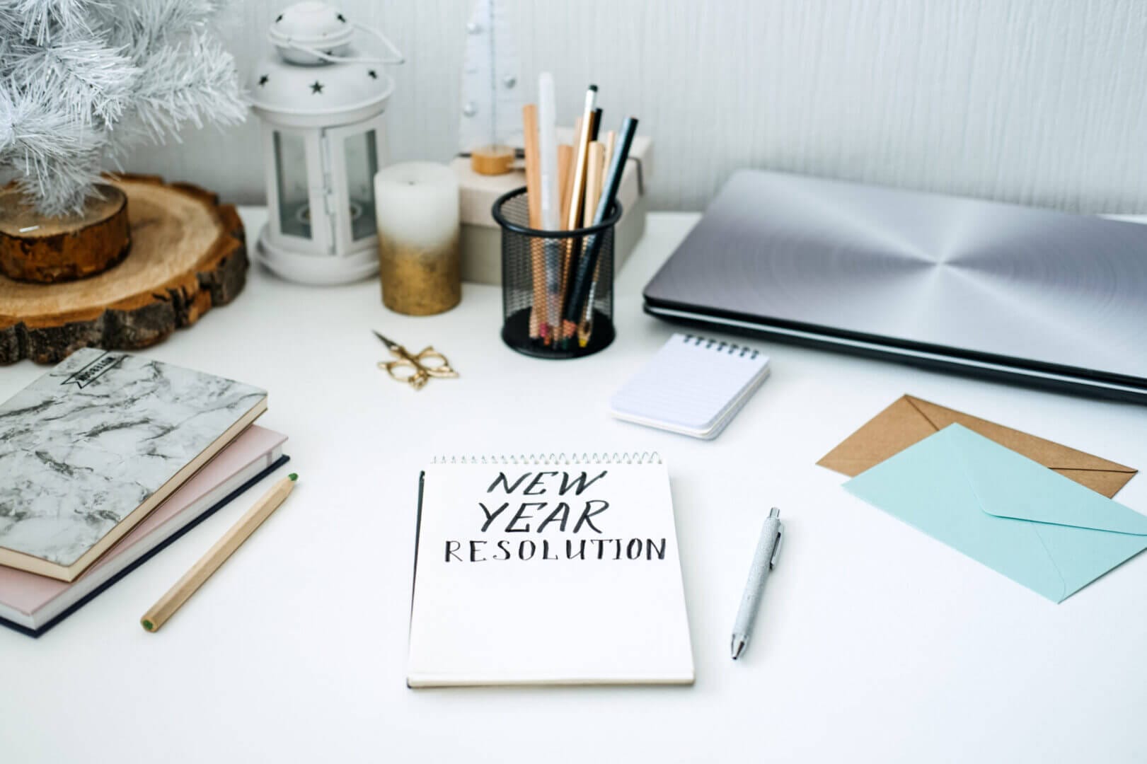 New year resolution notebook on desk, perfect for goal setting with Elevate Your Organization's Culture and Performance With CEEK.