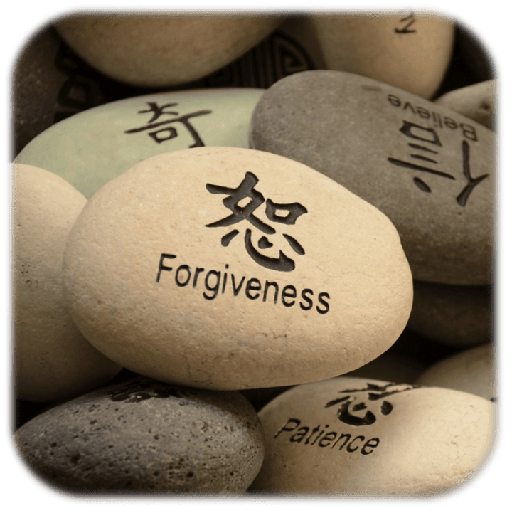 Stone with 'Forgiveness' and Asian character, symbolizing mindfulness, only available at Elevate Your Organization's Culture and Performance With CEEK.