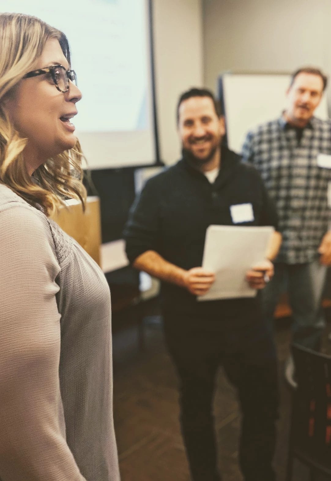 Team collaboration and discussion in a professional setting, available at Elevate Your Organization's Culture and Performance With CEEK.